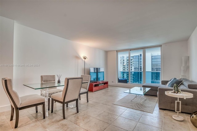 living room featuring floor to ceiling windows