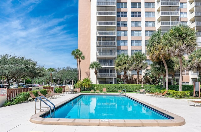 view of swimming pool with a patio area