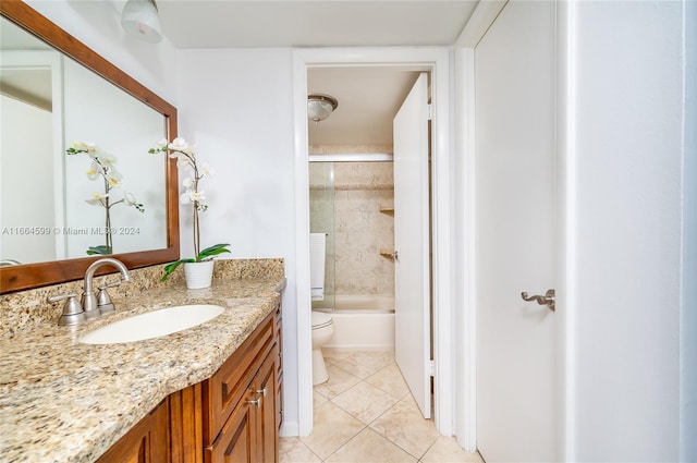 full bathroom with vanity, tile patterned floors, toilet, and combined bath / shower with glass door