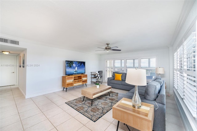 living room with ceiling fan, light tile patterned floors, and ornamental molding