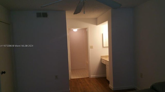 3204 Glenmoor Dr Unit 3204, West Palm Beach, FL 33409 - bathroom featuring a ceiling fan, wood finished floors, baseboards, vanity, and a shower