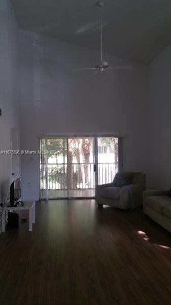 3204 Glenmoor Dr Unit 3204, West Palm Beach, FL 33409 - living area featuring high vaulted ceiling, wood finished floors, and a ceiling fan