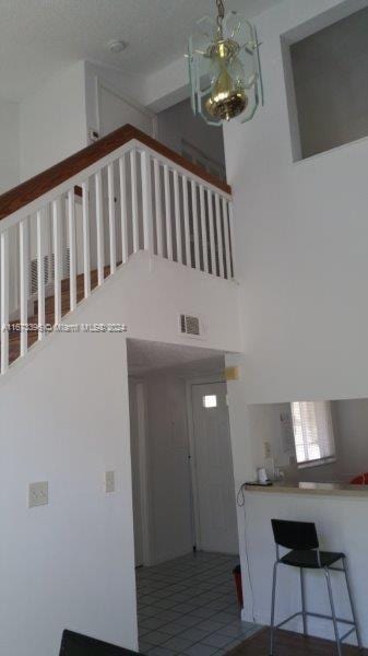 3204 Glenmoor Dr Unit 3204, West Palm Beach, FL 33409 - tiled foyer entrance with a high ceiling