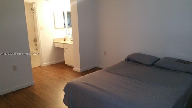 3204 Glenmoor Dr Unit 3204, West Palm Beach, FL 33409 - bedroom featuring light wood finished floors and baseboards