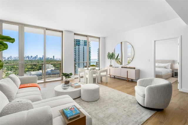 2678 Tigertail Ave Unit 1504B, Miami, FL 33133 - living area featuring a view of skyline, a wall of windows, and wood finished floors
