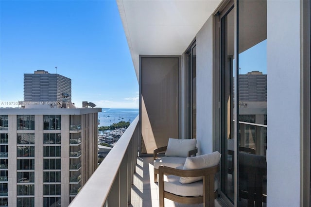 balcony featuring a water view