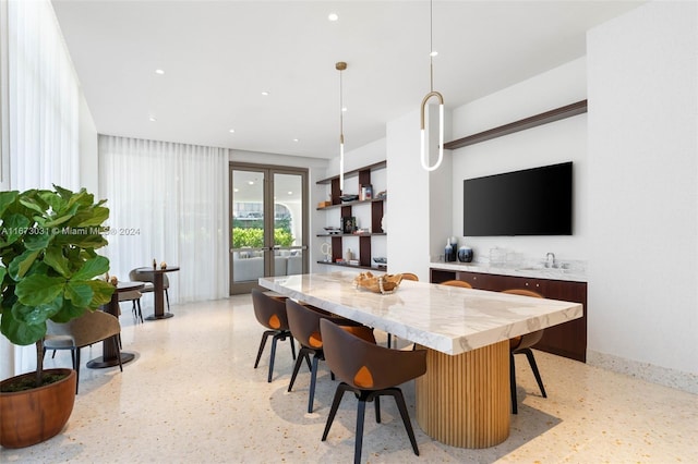 2678 Tigertail Ave Unit 1504B, Miami, FL 33133 - kitchen featuring dark speckled floor, french doors, a kitchen island, a sink, and recessed lighting