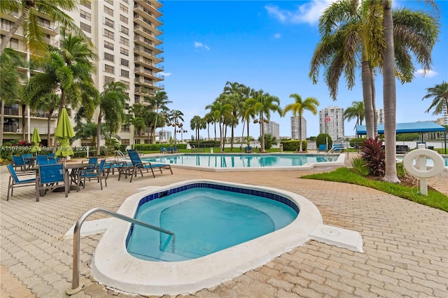 view of swimming pool with a patio area