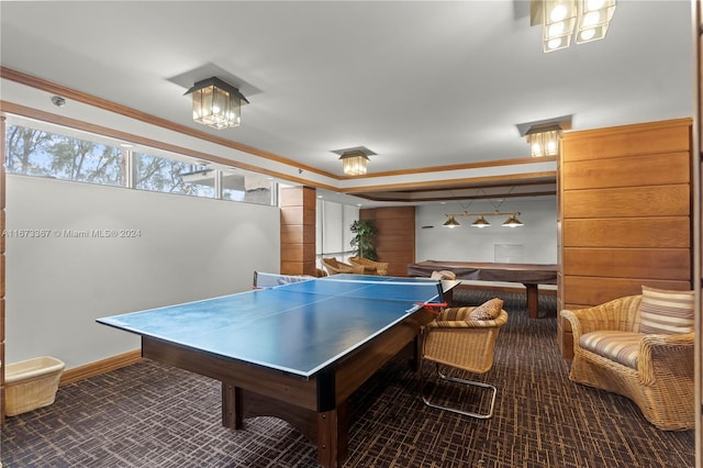 playroom with ornamental molding and carpet flooring