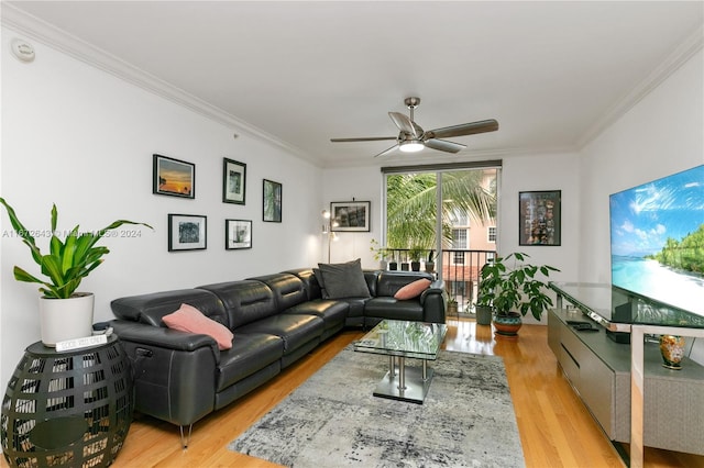 living room featuring ornamental molding, ceiling fan, and light hardwood / wood-style flooring