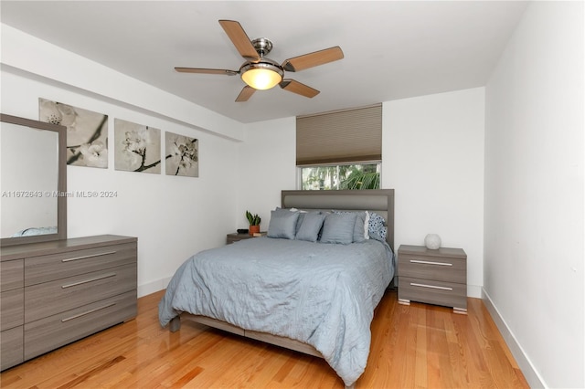 bedroom featuring light hardwood / wood-style floors and ceiling fan