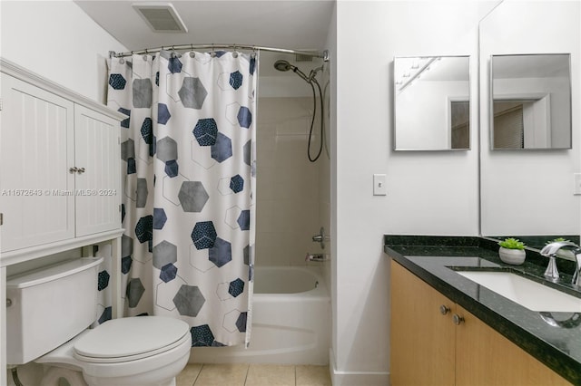 full bathroom with shower / tub combo, tile patterned floors, vanity, and toilet