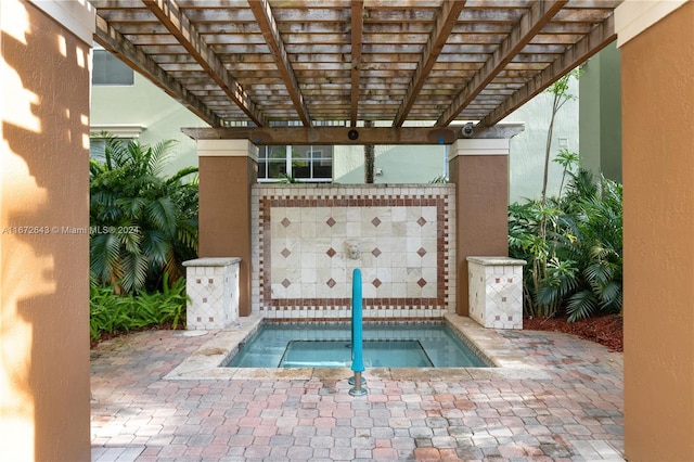 view of pool with a pergola and a patio area