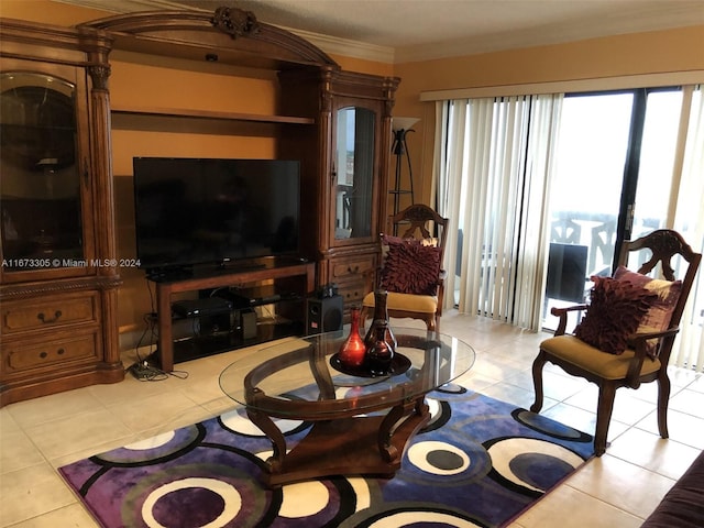 living room with light tile patterned floors and crown molding