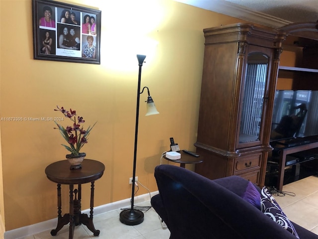 interior space with ornamental molding and light tile patterned floors