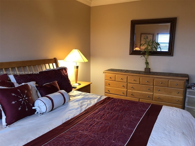 bedroom with ornamental molding