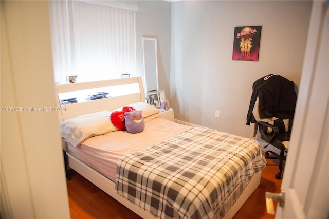 bedroom featuring dark wood-type flooring