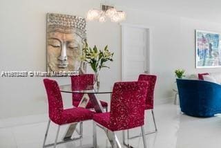 dining area with a notable chandelier