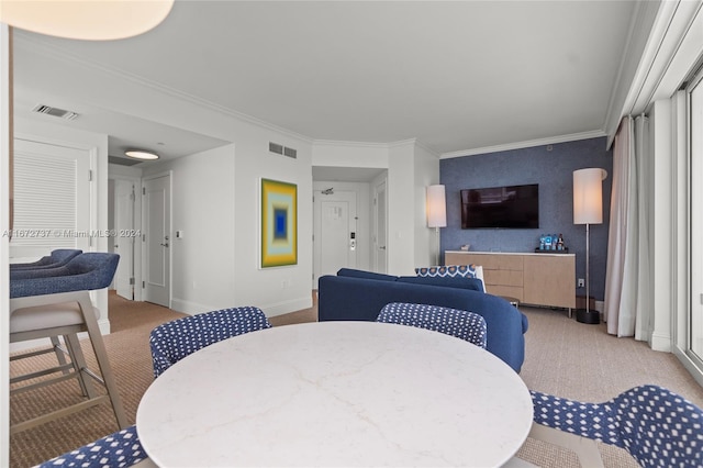 dining space featuring crown molding and light colored carpet