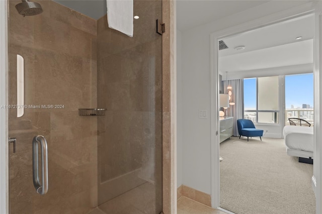 bathroom featuring a shower with shower door