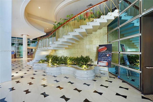 staircase with tile patterned floors