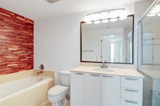 bathroom with toilet, a relaxing tiled tub, and vanity