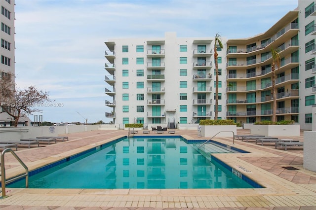 view of swimming pool with a patio