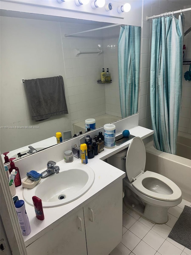 full bathroom featuring tile patterned floors, vanity, shower / tub combo with curtain, and toilet