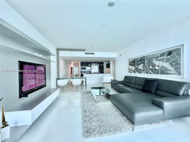 living room with tile patterned flooring