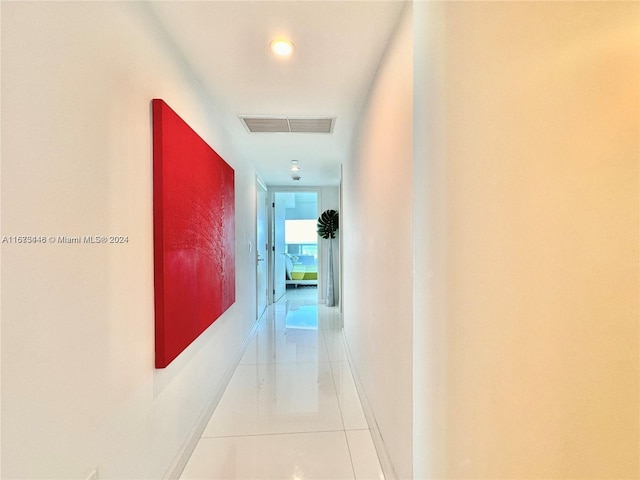 hallway featuring light tile patterned floors