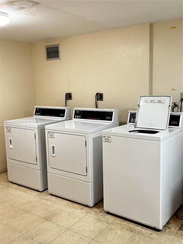 laundry room featuring washing machine and dryer