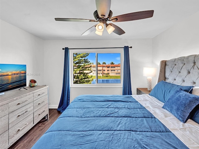 bedroom featuring ceiling fan and dark hardwood / wood-style floors