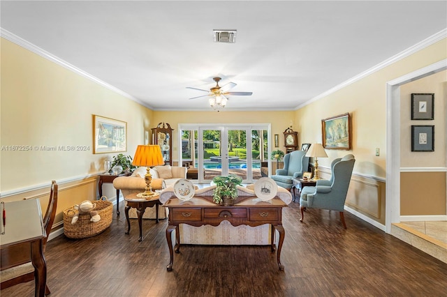 living area featuring french doors, crown molding, visible vents, a ceiling fan, and wood finished floors