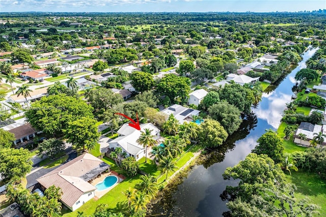 bird's eye view featuring a water view and a residential view