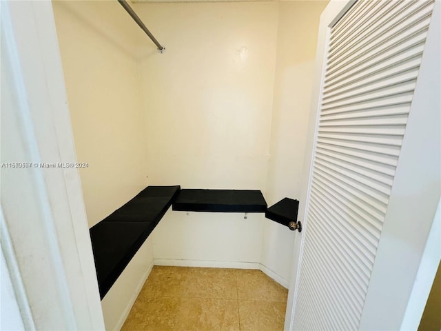 spacious closet with light tile patterned flooring