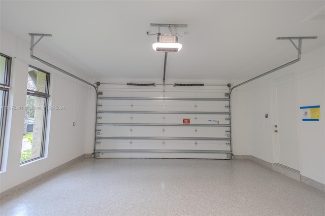 garage featuring a garage door opener