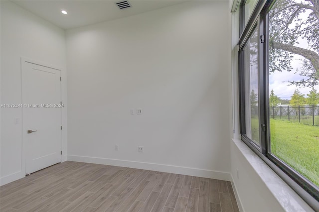 unfurnished room with light hardwood / wood-style flooring