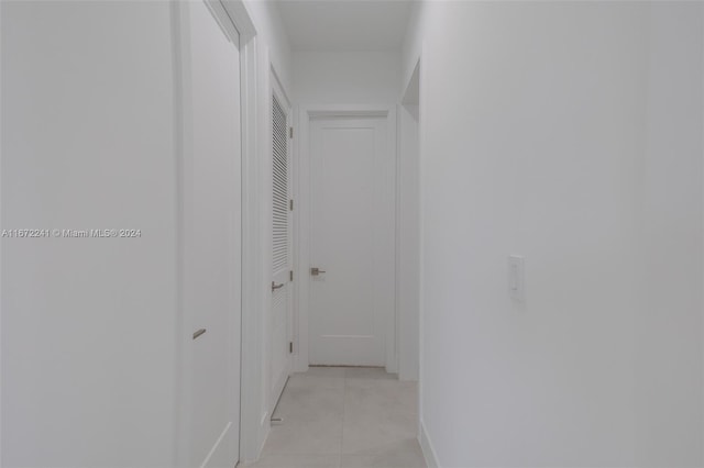 hallway featuring light tile patterned floors