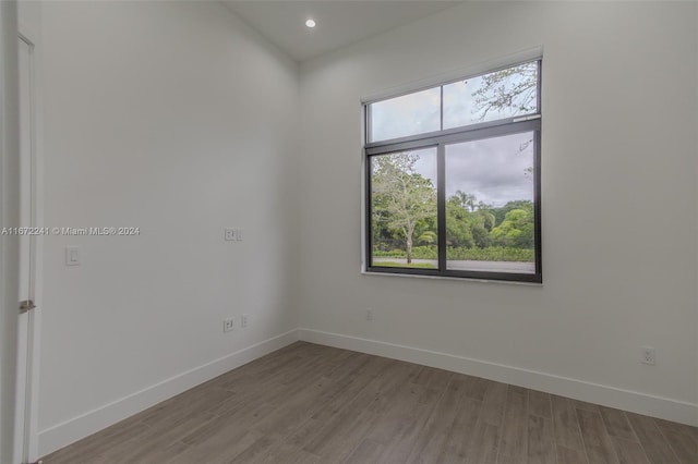 empty room with wood-type flooring