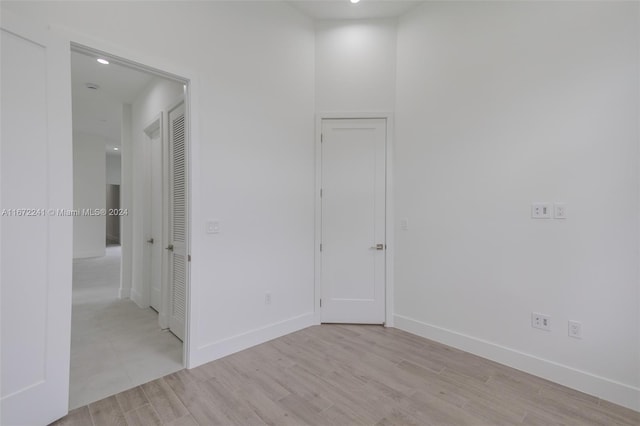 spare room with light wood-type flooring