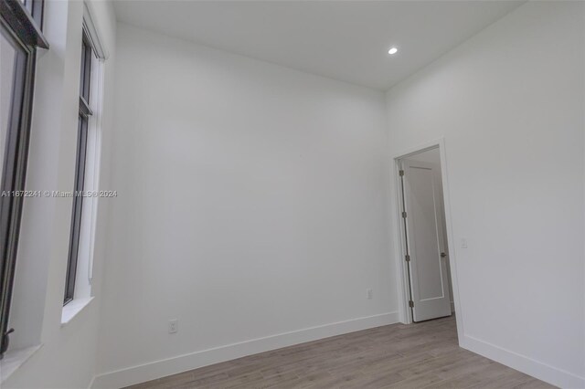 spare room with light wood-type flooring