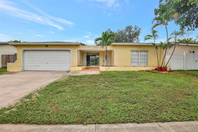 single story home with a front lawn and a garage