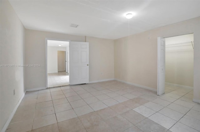 spare room with light tile patterned floors