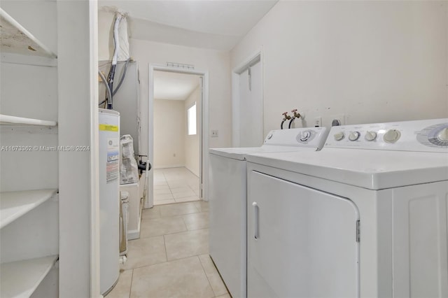 washroom featuring light tile patterned floors and separate washer and dryer