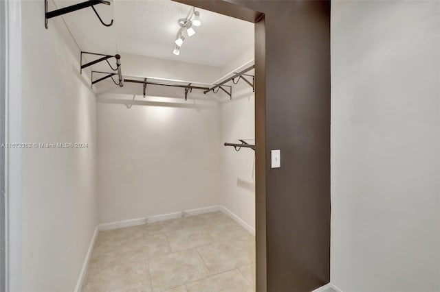 walk in closet featuring light tile patterned floors