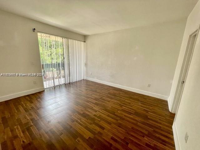 9173 Fontainebleau Blvd Unit 3, Miami, FL 33172 - unfurnished room featuring dark wood-style floors and baseboards