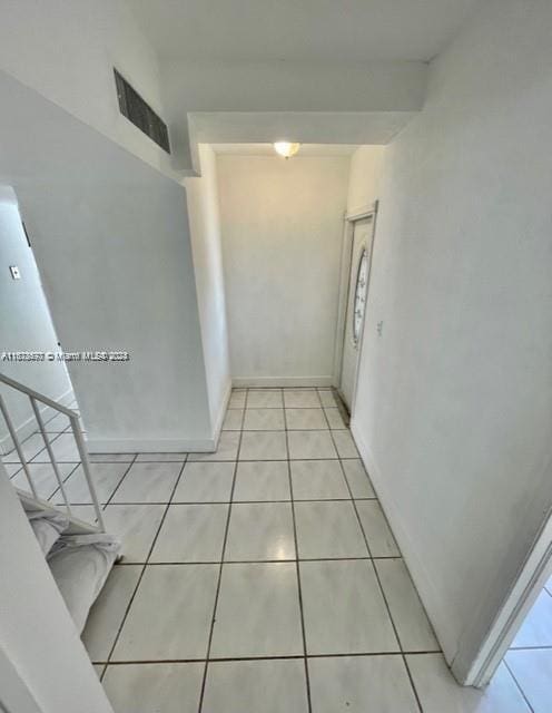 9173 Fontainebleau Blvd Unit 3, Miami, FL 33172 - hall featuring light tile patterned flooring and baseboards