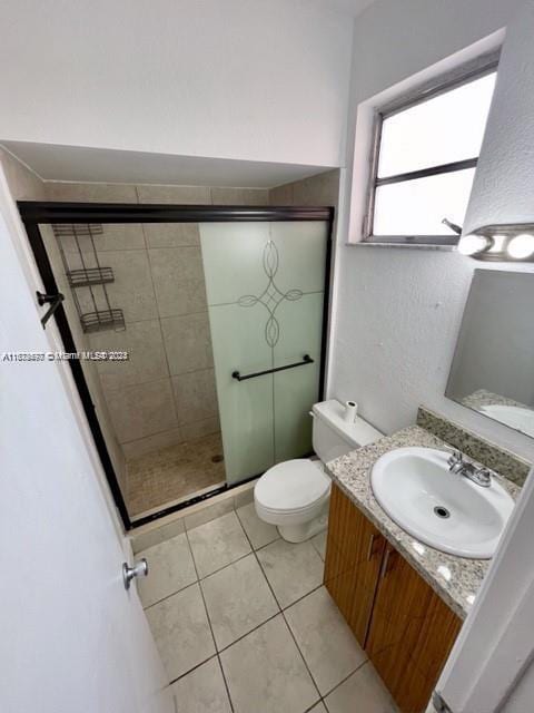 9173 Fontainebleau Blvd Unit 3, Miami, FL 33172 - full bathroom with vanity, a shower stall, toilet, and tile patterned flooring