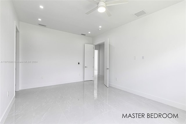 unfurnished room featuring ceiling fan