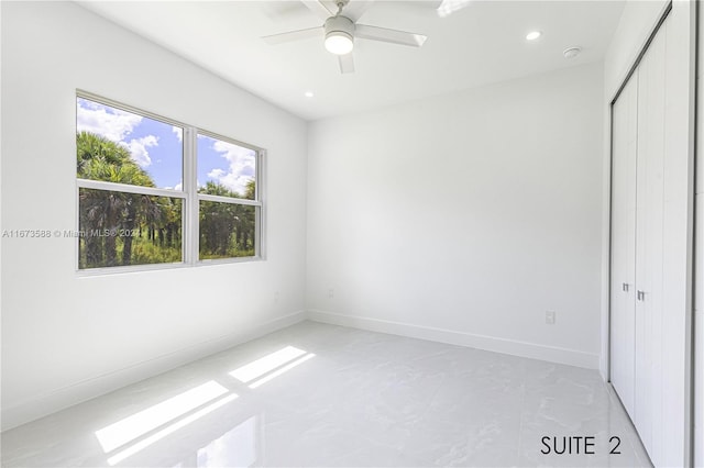 unfurnished room featuring ceiling fan